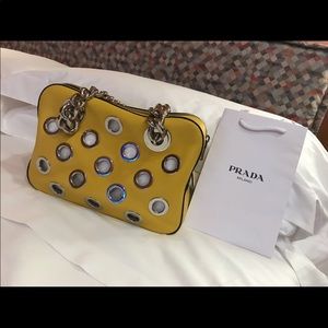 Prada yellow grommet bag